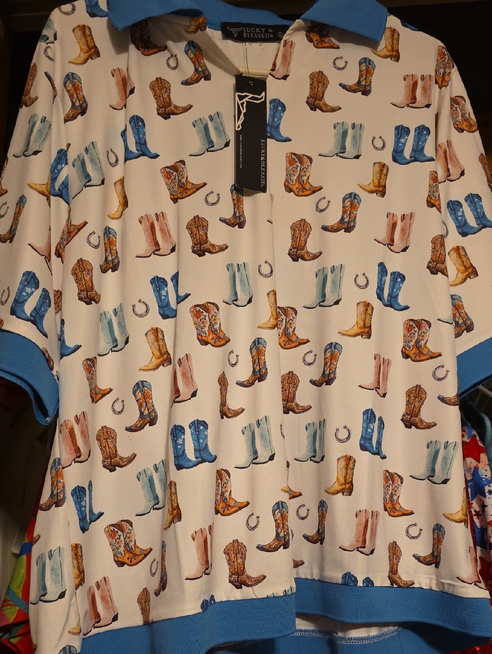 Lucky & Blessed Cream Polo with Blue Trim and Multicolor Cowboy Boot Print